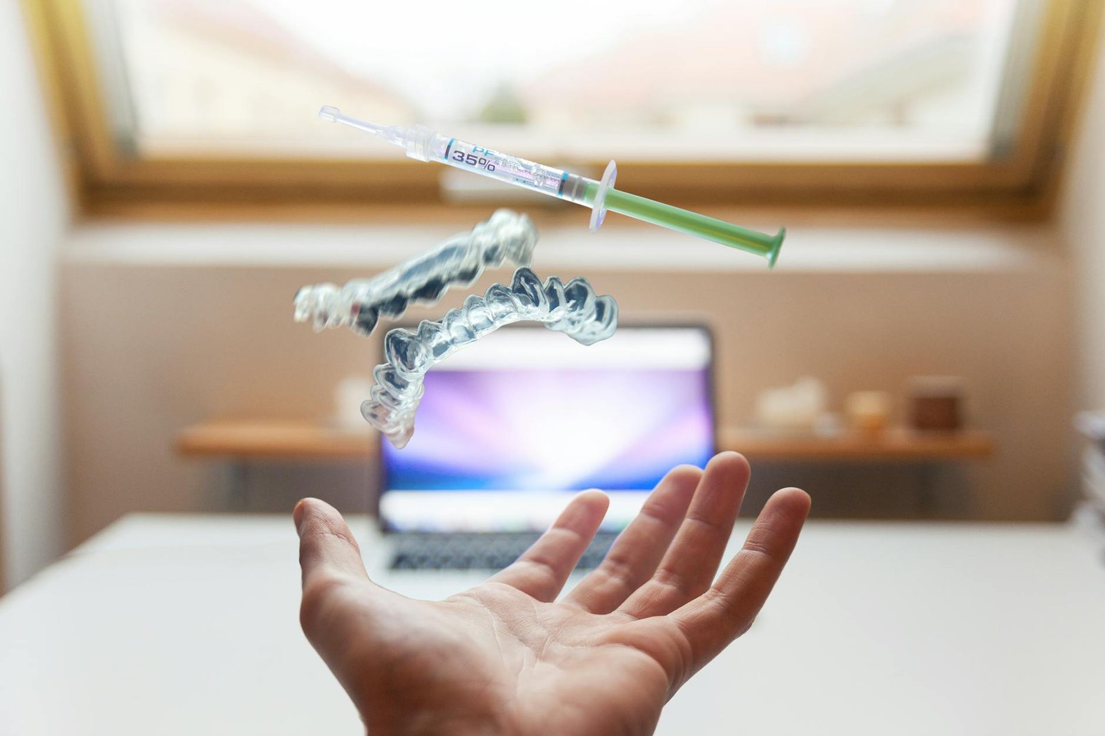 syringe floating near person s hand